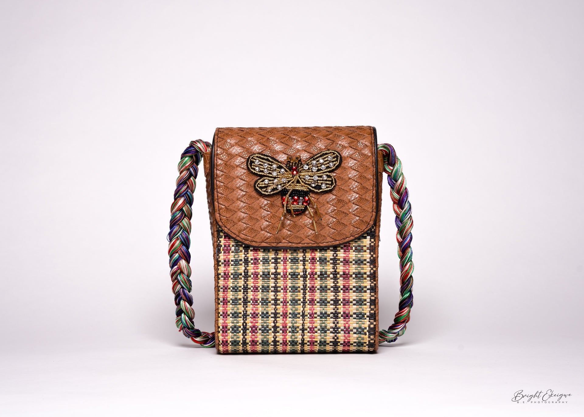 Elegant handcrafted bag with rich African prints, ideal as a timeless statement piece for cultural and modern styling.