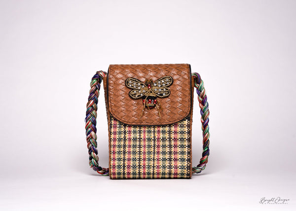 Elegant handcrafted bag with rich African prints, ideal as a timeless statement piece for cultural and modern styling.